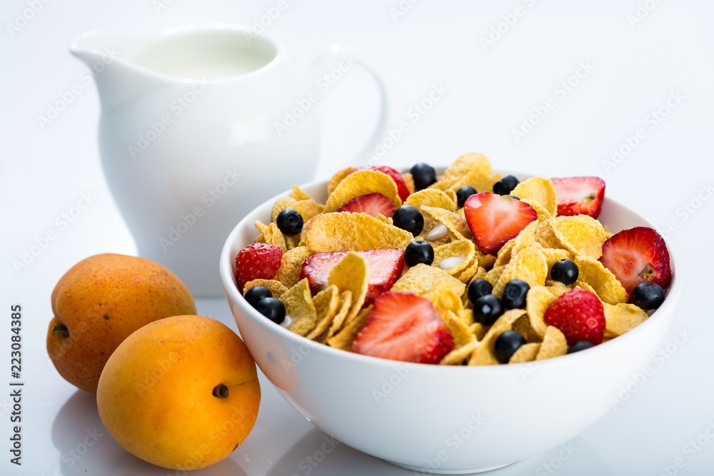 Bowl of Cornflakes, Blueberries, Strawberries and Milk Bowl of Cornflakes, Blueberries, Strawberries and Milk