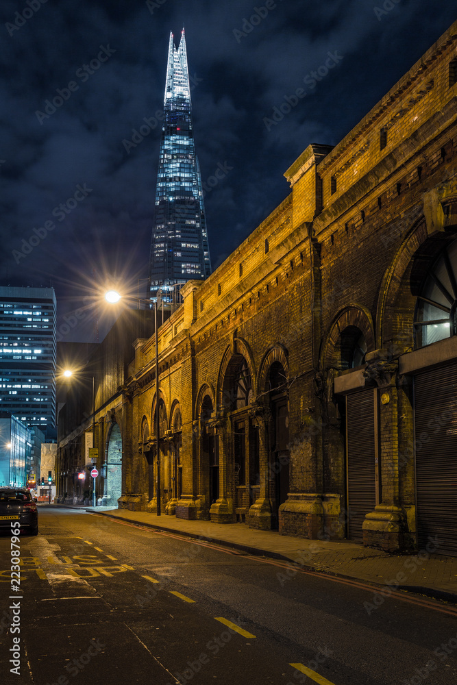 London street at night with the Shard