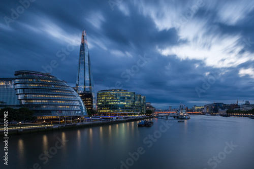 London's City Hall and the Shard with dramatic storm clouds