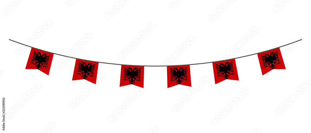 Fototapeta premium Bunting decoration in colors of Albania flag. Garland, pennants on a rope for party, carnival, festival, celebration. For National Day of Albania on August&nbsp;18