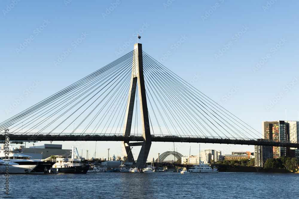 Peak hour on Anzac Bridge, Sydney, Australia. Water views to Sydney Harbour Bridge