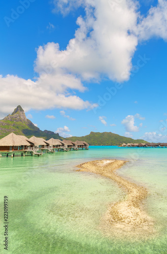 Nice view of traditional tropical villas with beautiful view of Mount Otemanu, French Polynesia