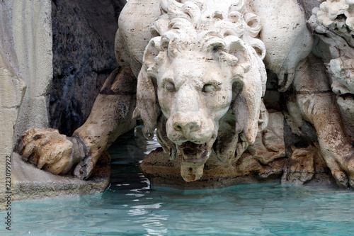 Lion sculpture detail in The Fountain of the Four Rivers (The Fontana dei Quattro Fiumi) in the Piazza Navona in Rome, Italy.  Monument was built by Gian Lorenzo Bernini in 1651. © Richard McGuirk