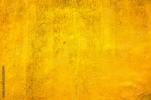 Yellow dyed wall texture background. Plastered and dyed wall surface.