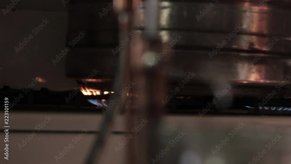 Home production of alcohol on flame fire. Alcohol distillation ...