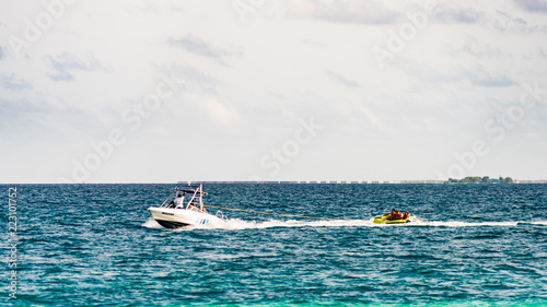 Boat pulling funtube. Riding funtube in Maldives.