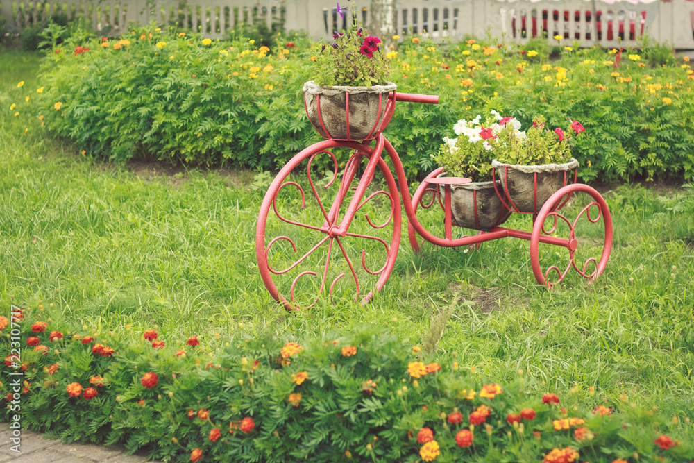 Flowers in a basket on a vintage bicycle