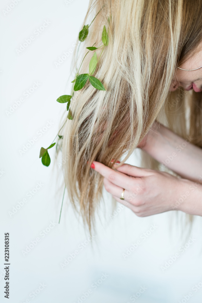 Naklejka premium harmony with nature. eco friendly sustainable lifestyle. natural hair products. blond girl wearing flowers in her updo.
