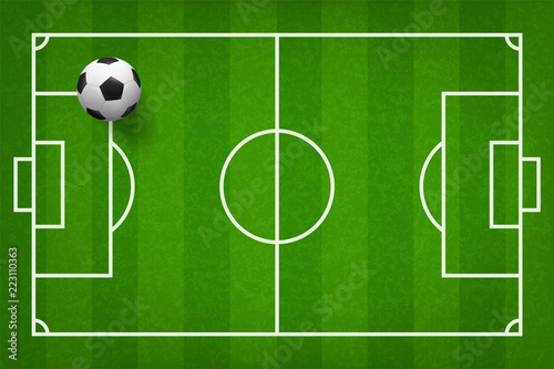 Soccer football ball on green grass of soccer field pattern background. Vector.