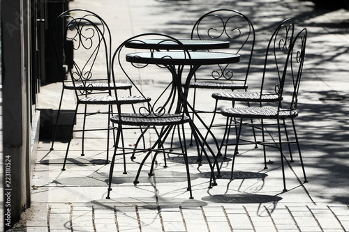 Empty coffee terrace with tables and chairs
