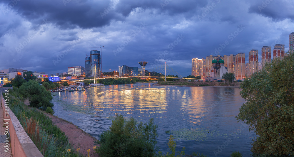 Fototapeta premium Moscow region. July 02, 2018. Panorama of the city before the rain. The embankment. Pavshinsky Bridge. Crocus City Exhibition Complex and the Government House
