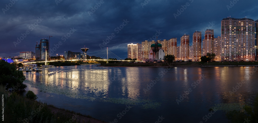 Moscow region. July 02, 2018. Panorama. Night city lights.  The embankment.  Pavshinsky Bridge. Crocus City Exhibition Complex and the Government House