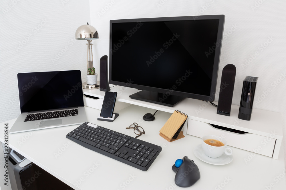 Computer and devices on modern white desk interior 3D rendering