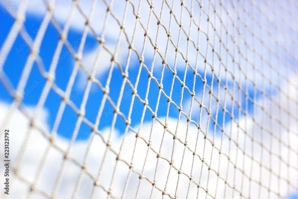 Mesh soccer outdoors. close-up. macro. football goal against the sky. Mesh soccer outdoors. close-up. macro. football goal against the sky.