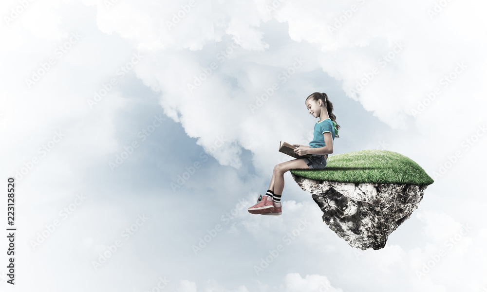 Concept of careless happy childhood with girl reading book Concept of careless happy childhood with girl reading book