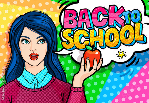 Young woman, teacher in front of a blackboard