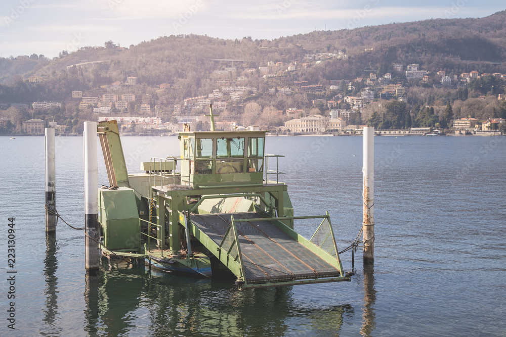 Industrial barge floats on the Como lake