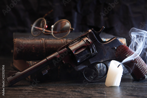 Old Revolver Near Book photo