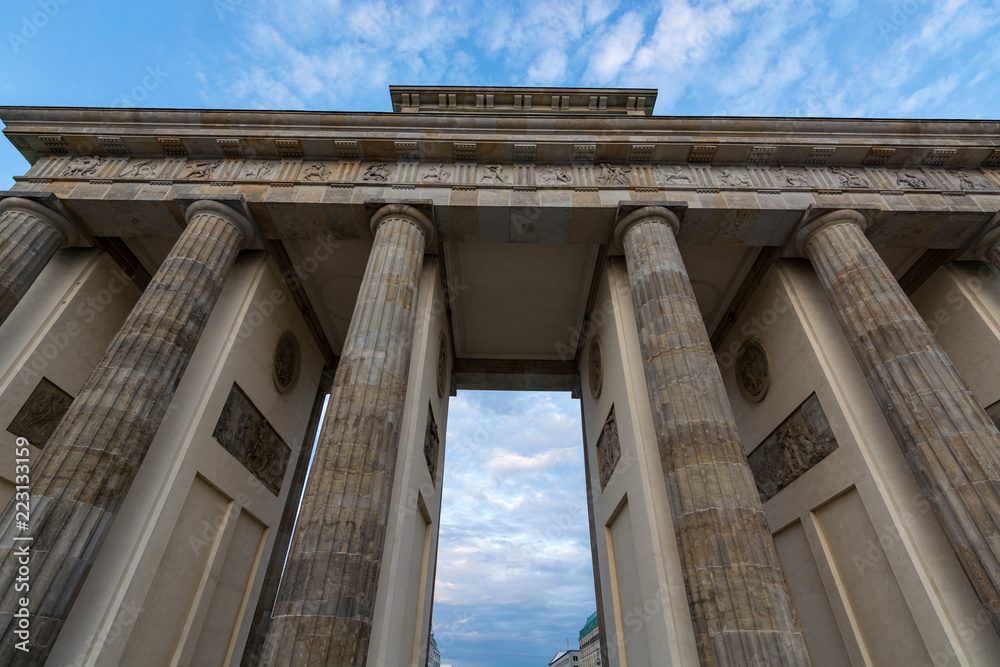 Fototapeta premium The Brandenburg Gate in Berlin from below