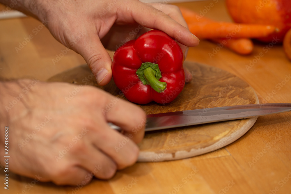 cutting red pepper on wooden board cutting red pepper on wooden board