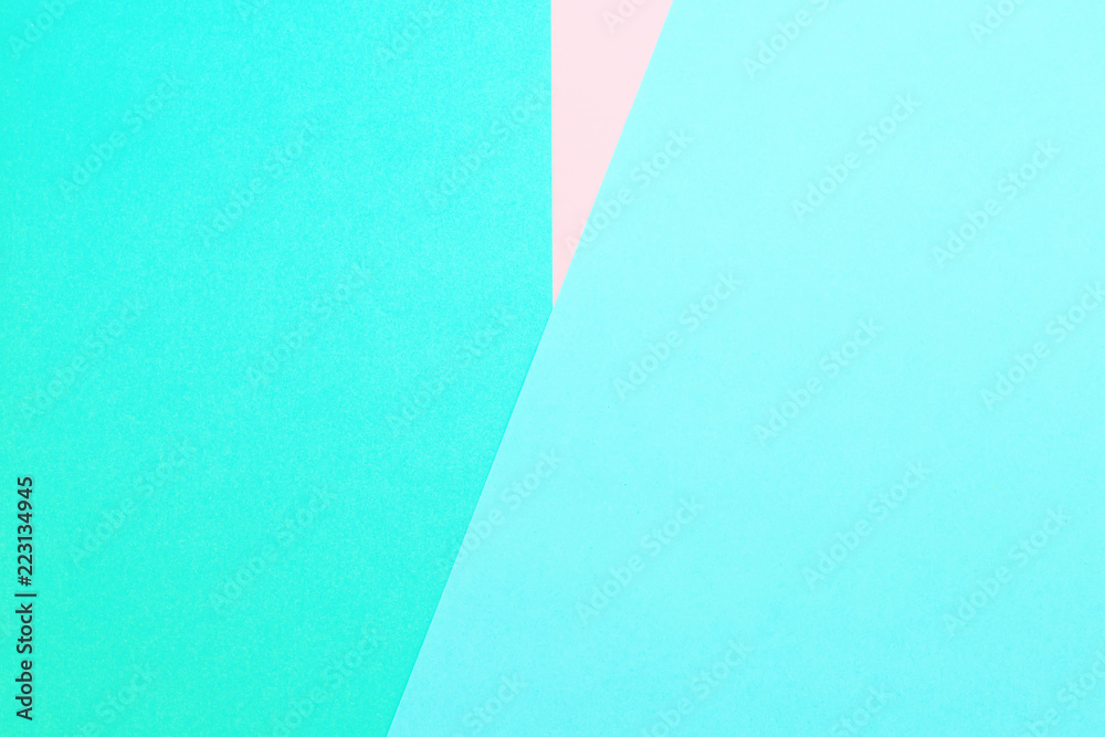 Triangle. Blue, pink and light green color paper background. Image with space for text. Triangle. Blue, pink and light green color paper background. Image with space for text.