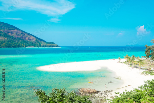 Beautiful white sand beach and tree with island in summer time concept travel, holiday and vacation. Tropical paradise beach nature landscape in Thailand