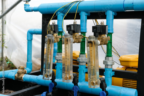 smart agriculture with internet of things, iot. rotameter measure water fertilizer flow rate in greenhouse photo