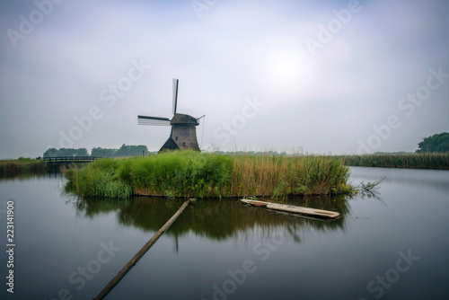 Old dutch windmill in cold morning scenery