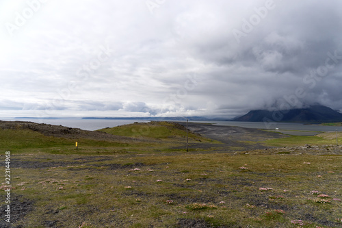 Dramatic sky and clouds above typical Icelandic mountains. Spectacular landscape