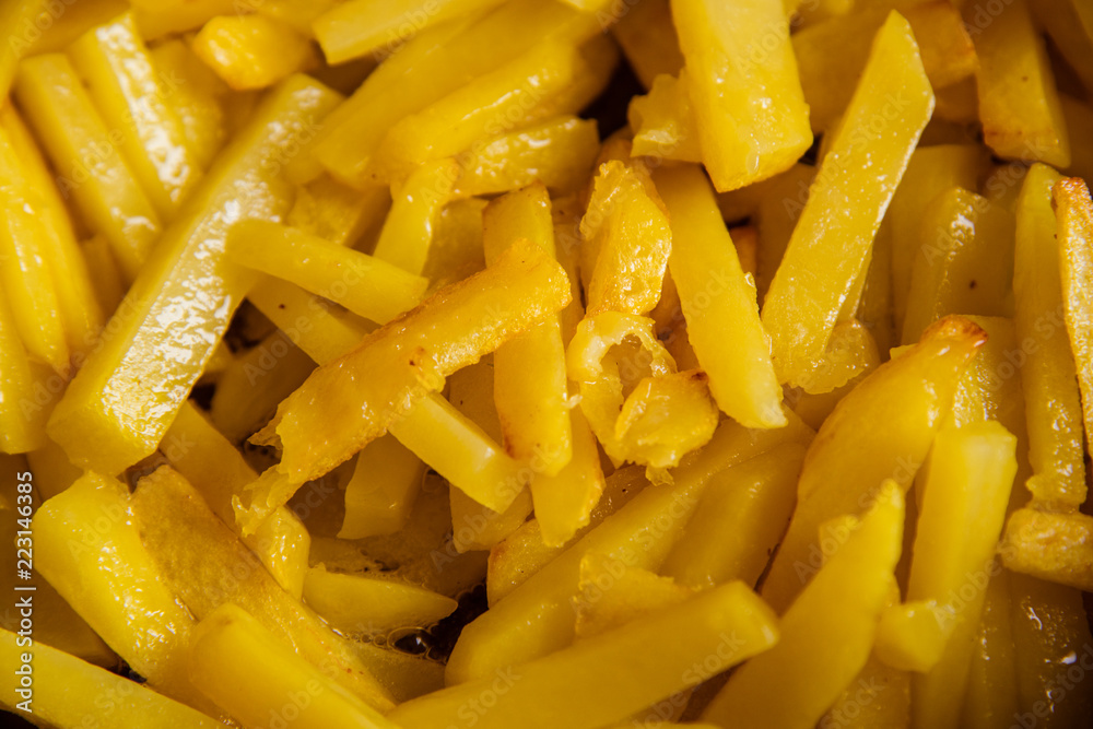 The potato is fried in a frying pan The potato is fried in a frying pan