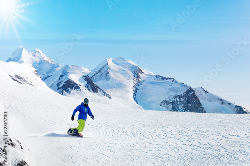 Winter snowboarding activity on sunny day in Alps