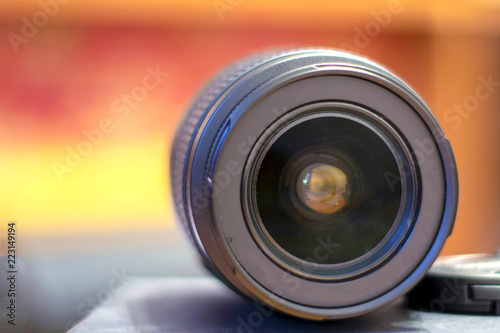 Macro view of professional photograph camera lens, isolated on white background.