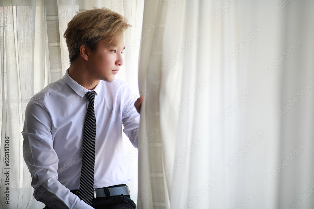 Young Asian businessman in white shirt and tie Young Asian businessman in white shirt and tie