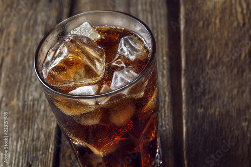 A glass with ice and cola.