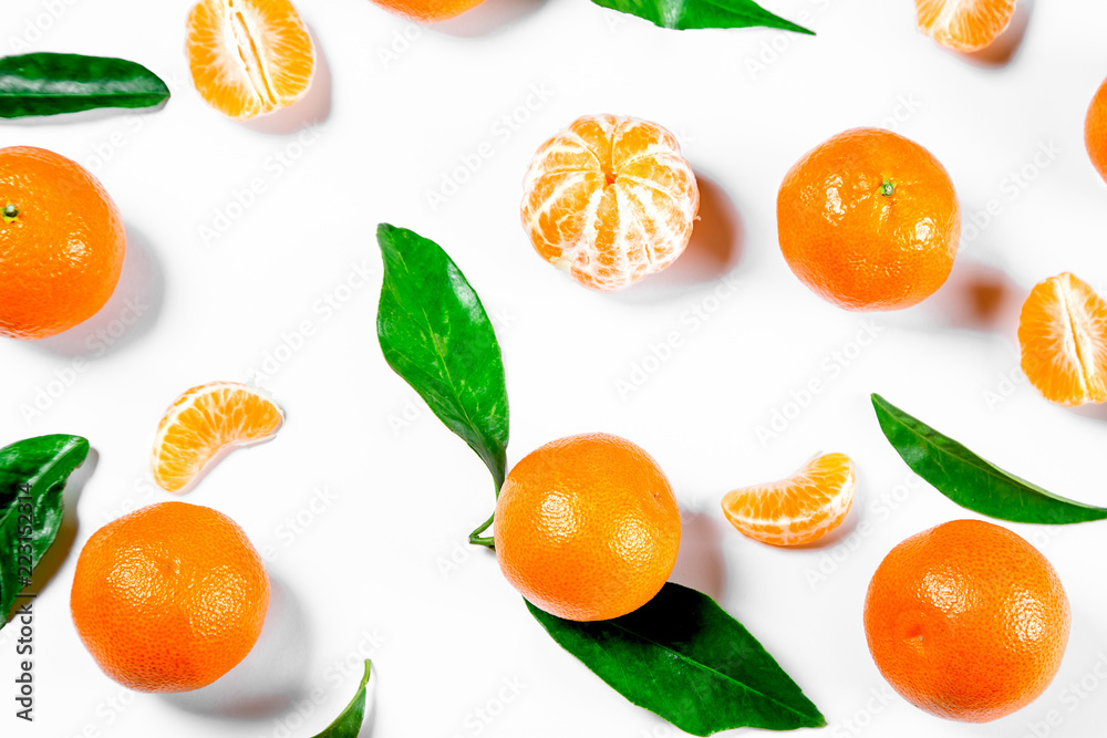 Ripe Orange Tangerine (Mandarin) With Leaves Close-up On The White Background. Ripe Orange Tangerine (Mandarin) With Leaves Close-up On The White Background.