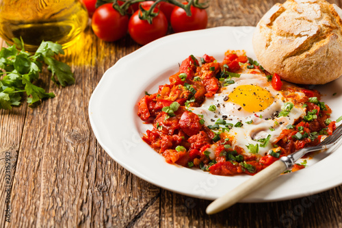 Shakshouka, dish of eggs poached in a sauce of tomatoes, chili peppers, onions