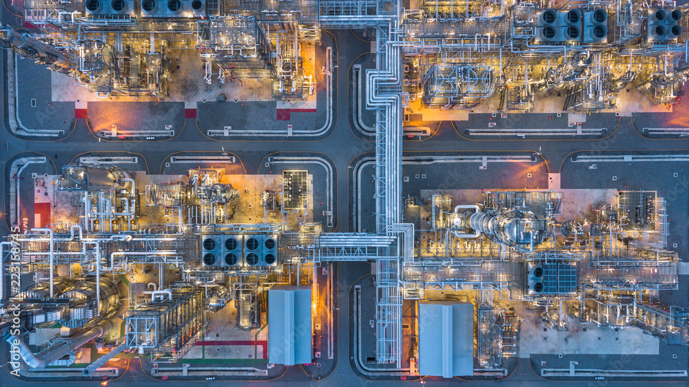 Aerial top view oil and gas refinery plant form industry zone at night ...