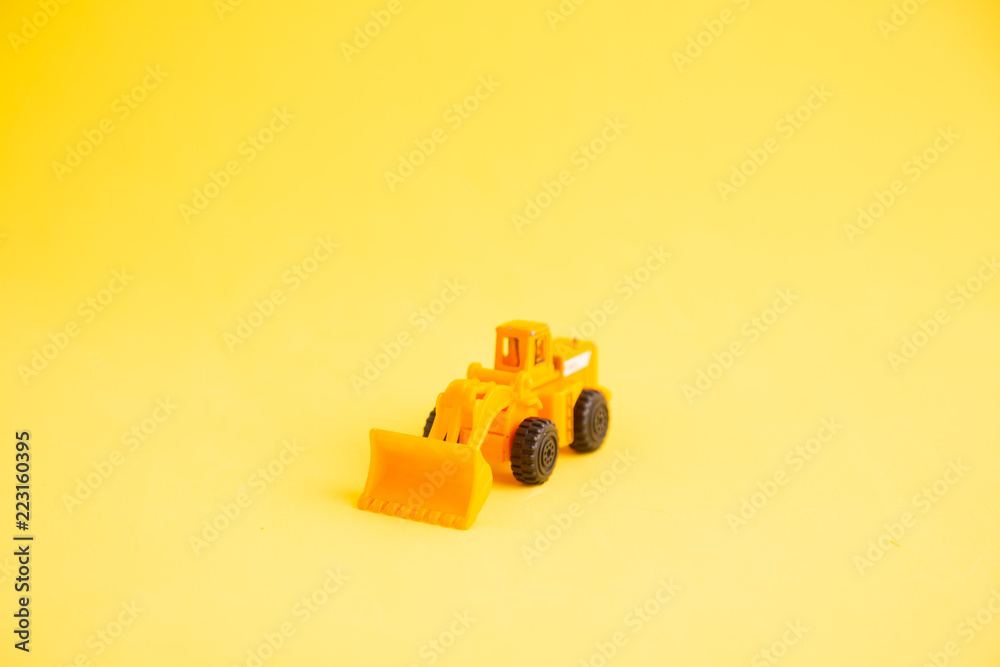 construction shovel toy in colorful background