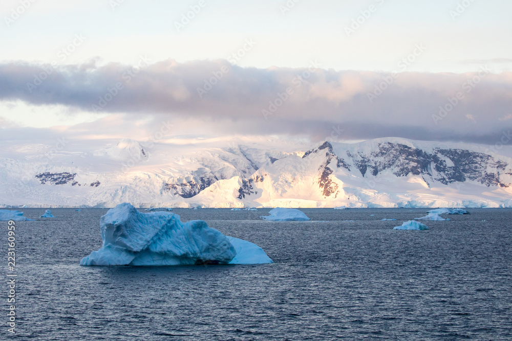 ice in the Antarctica with iceberg in the ocean