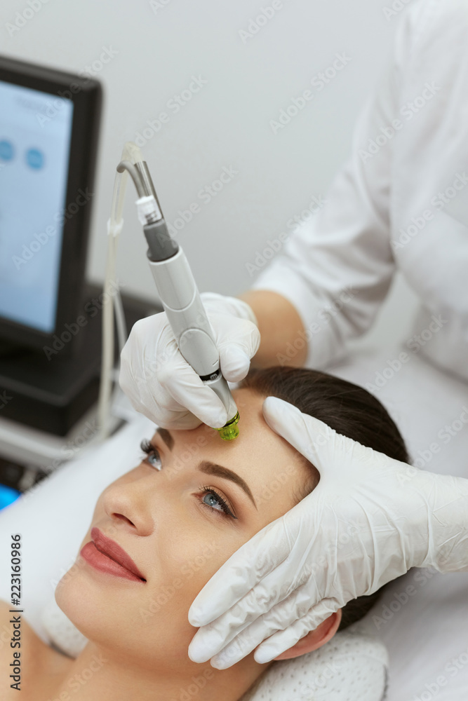 Face Skin Care. Woman Getting Facial Hydro Exfoliating Treatment Face Skin Care. Woman Getting Facial Hydro Exfoliating Treatment
