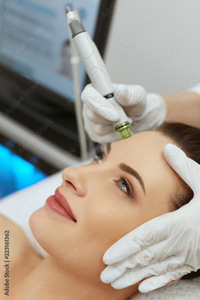 Face Skin Care. Woman Getting Facial Hydro Exfoliating Treatment Face Skin Care. Woman Getting Facial Hydro Exfoliating Treatment