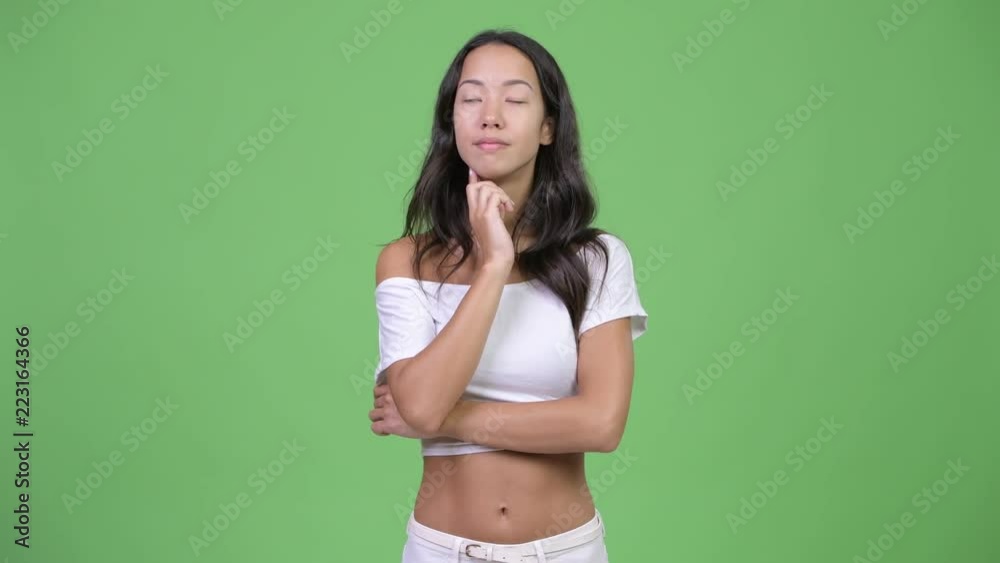 Young happy beautiful multi-ethnic woman thinking Young happy beautiful multi-ethnic woman thinking