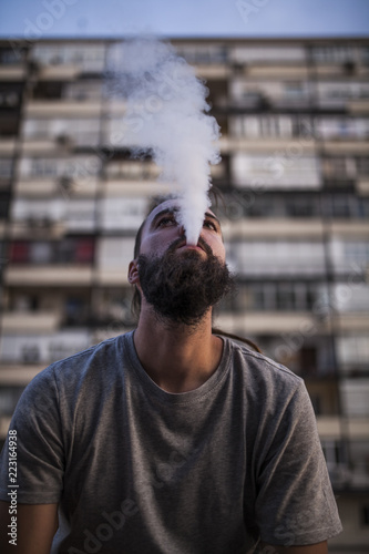 Rastafarian smoker young man photo