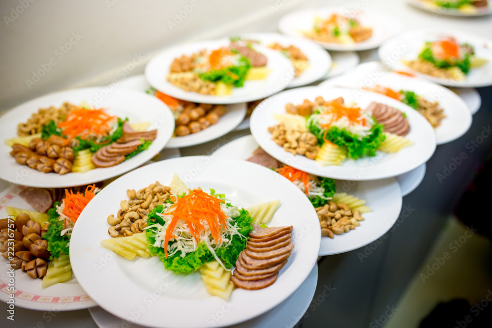 Many sets of food on white dish stand by to serve in wedding ceremony. Many sets of food on white dish stand by to serve in wedding ceremony.