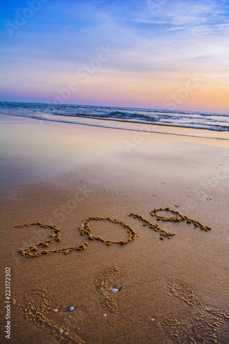 Happy New Year 2019 concept, lettering on the beach