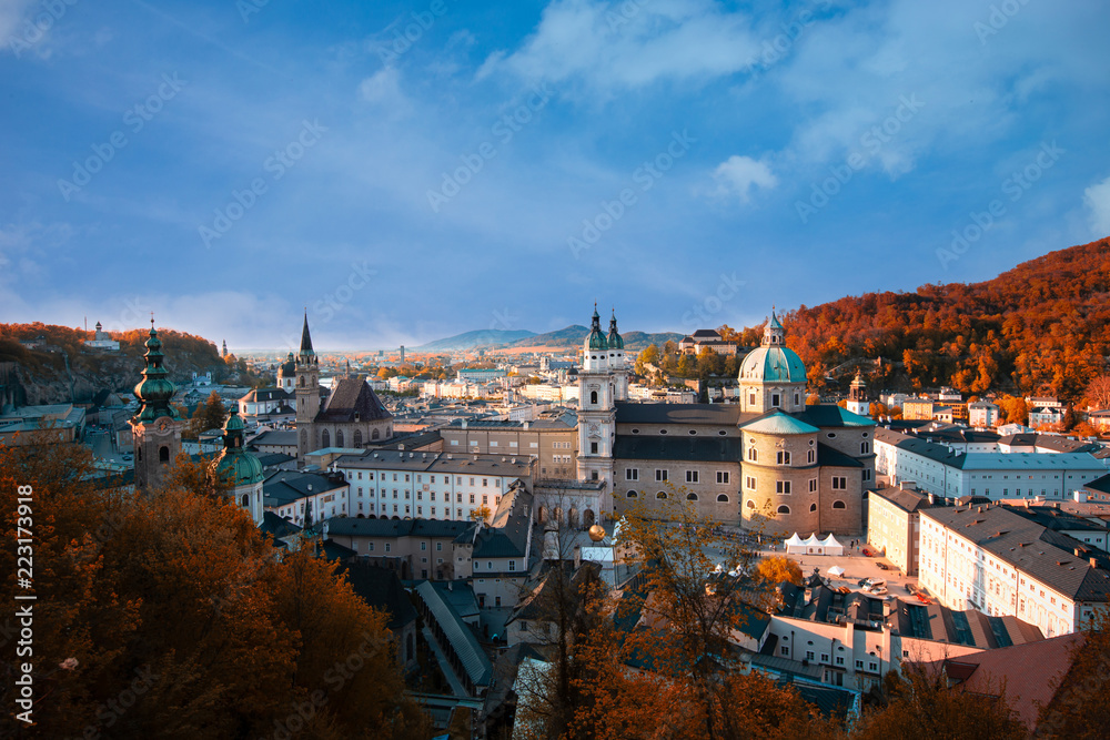 Beautiful of panoramic view in a Autumn season at a historic city of Salzburg , which Salzburg in a beautiful evening light with blue sky and colorful red and yellow of autumn,Salzburger Land, Austria