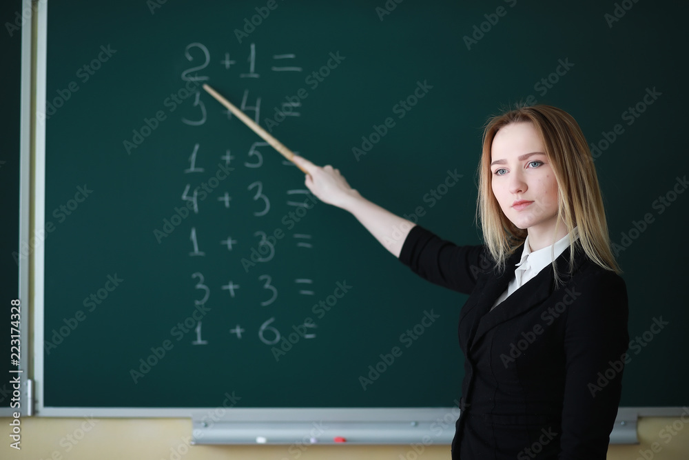 Young girl teacher in primary school Young girl teacher in primary school