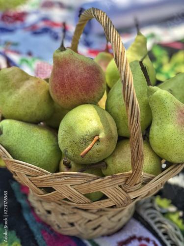 fresh ripe pears in a basket