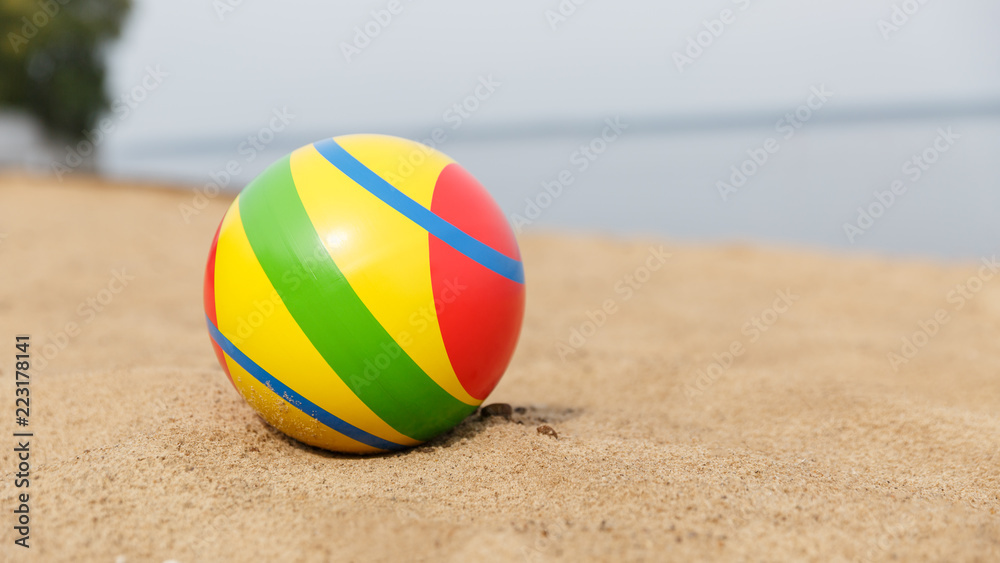 Children's ball on the sand