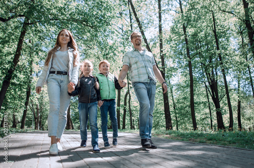 family walk in the city Park.